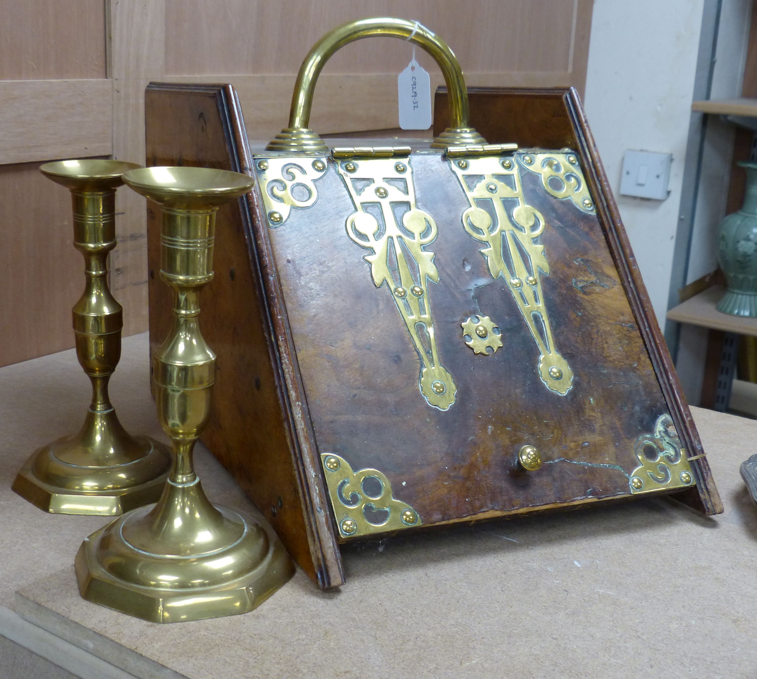 A Victorian brass bound walnut coal scuttle and a pair of brass candlesticks